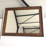 Old mirror with wooden frame and plaster moldings