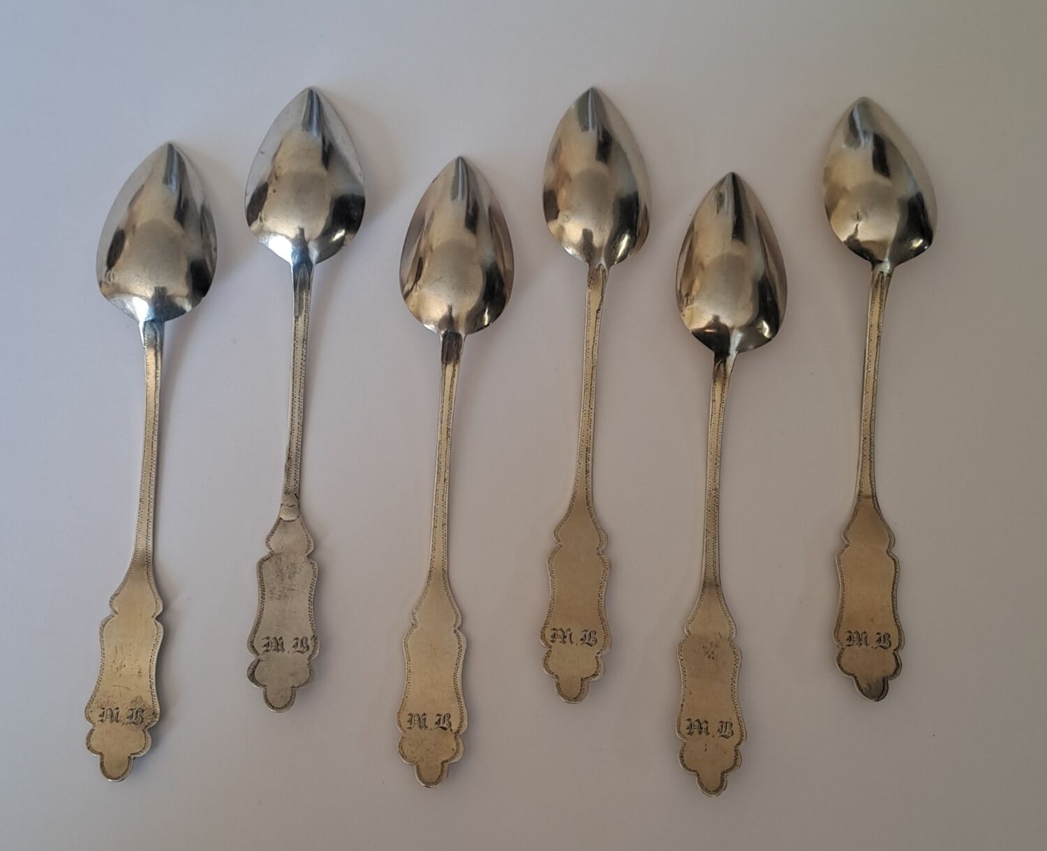 6 small numbered silver teaspoons, Minerva hallmark.