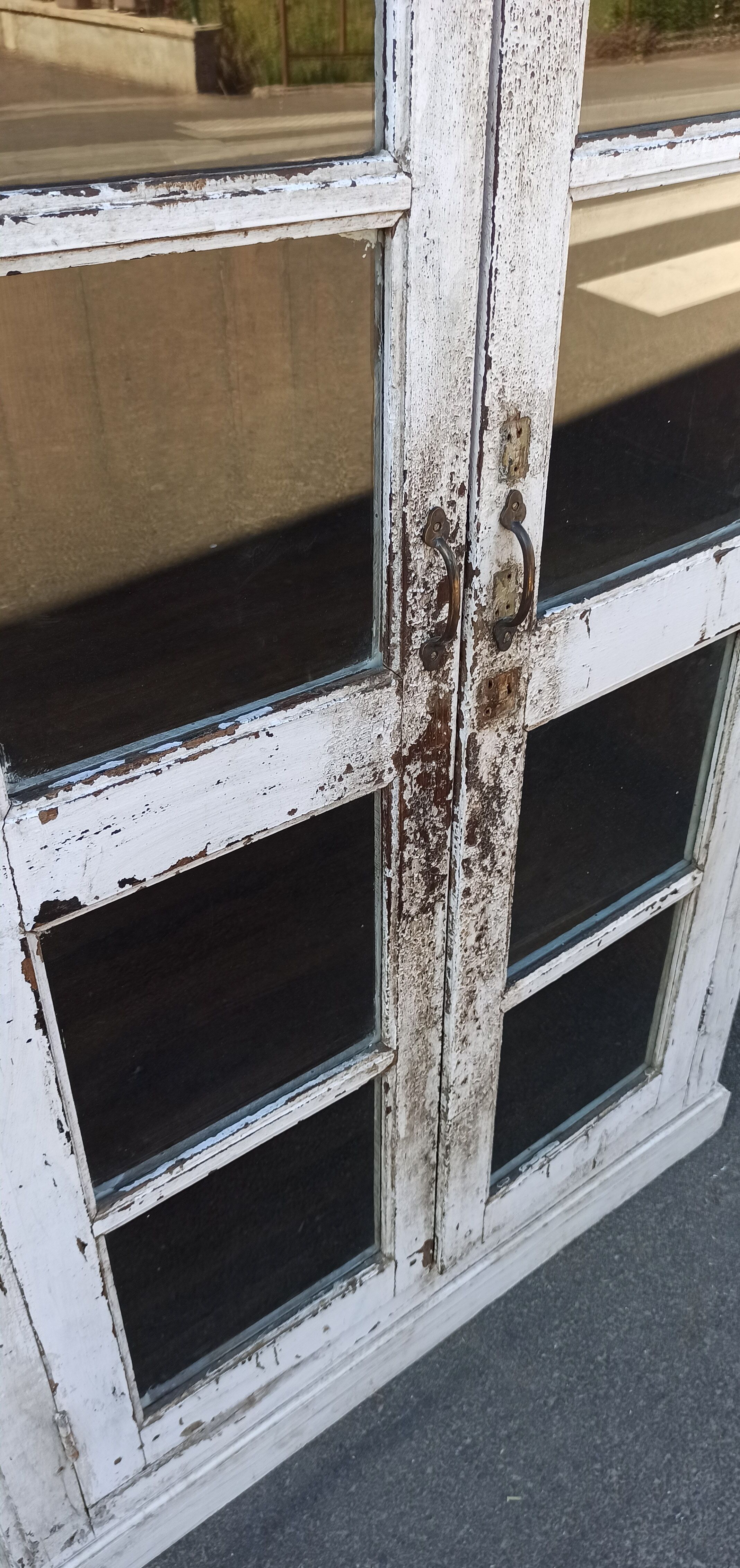 White wooden antique glazed wardrobe