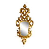 Carved and gilded wooden mirror with gold leaf 46 x 103 cm