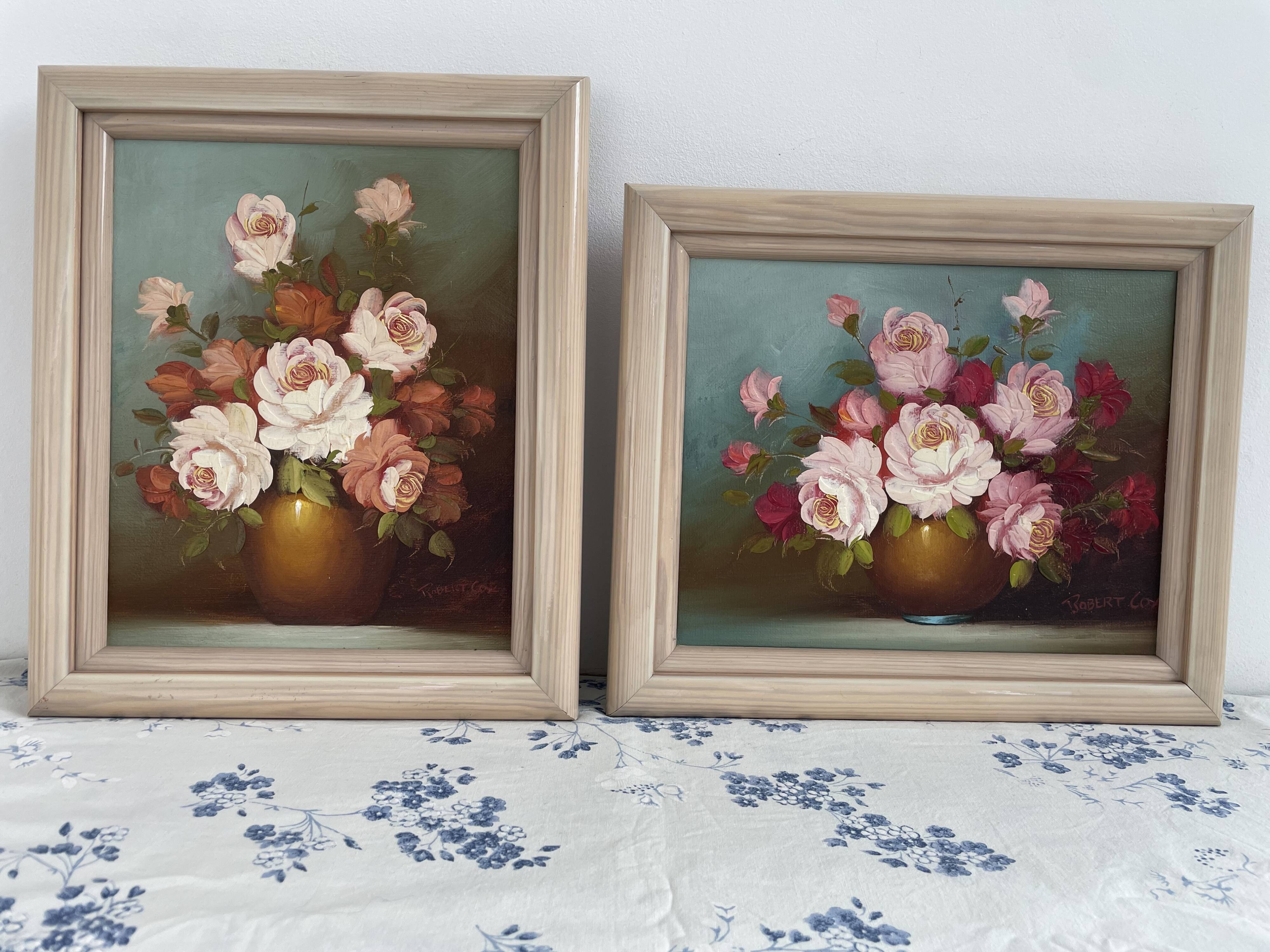 Pair of oils on canvas signed by Robert Cox, floral still lifes.