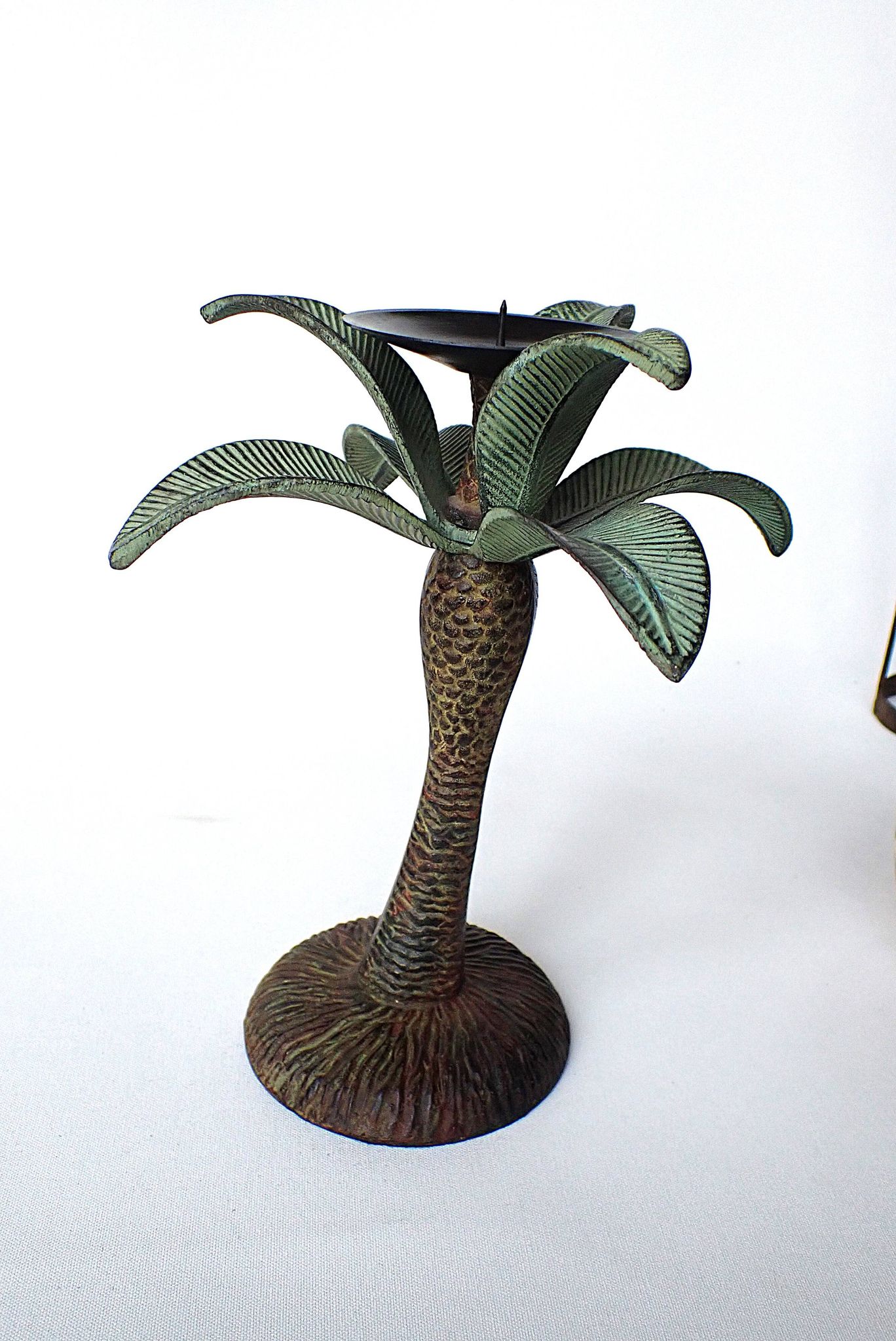 Antique palm tree-shaped candlestick in patinated metal