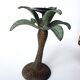 Antique palm tree-shaped candlestick in patinated metal