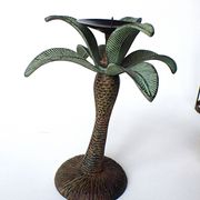 Antique palm tree-shaped candlestick in patinated metal