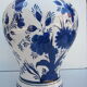Ceramic vase earthenware, blue floral decoration on a white background