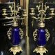 Pair of candlesticks. Bronze, brass, porcelain.