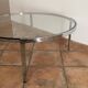 Table basse Space age. 1970. Acier chromé et verre.