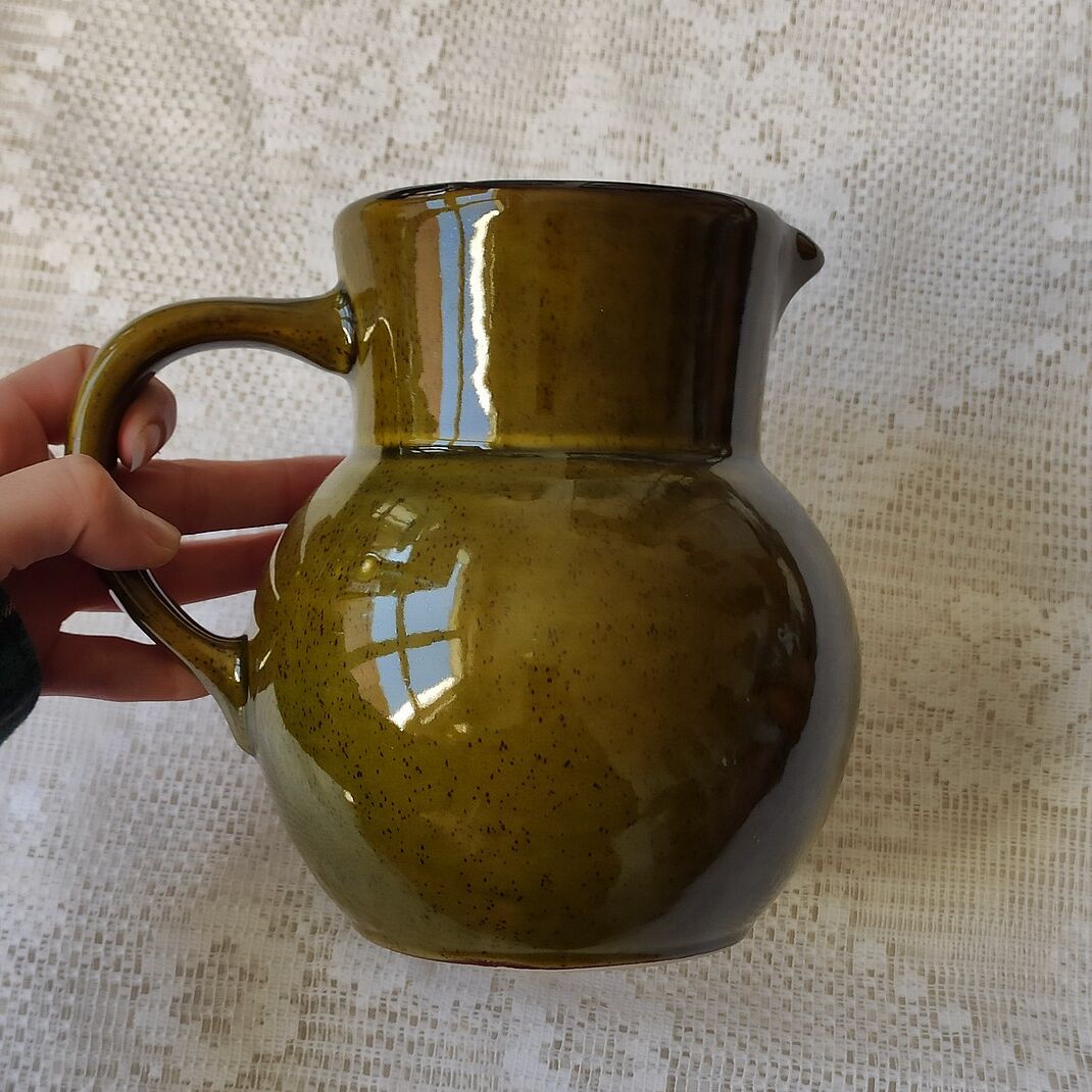 Green ceramic pitcher