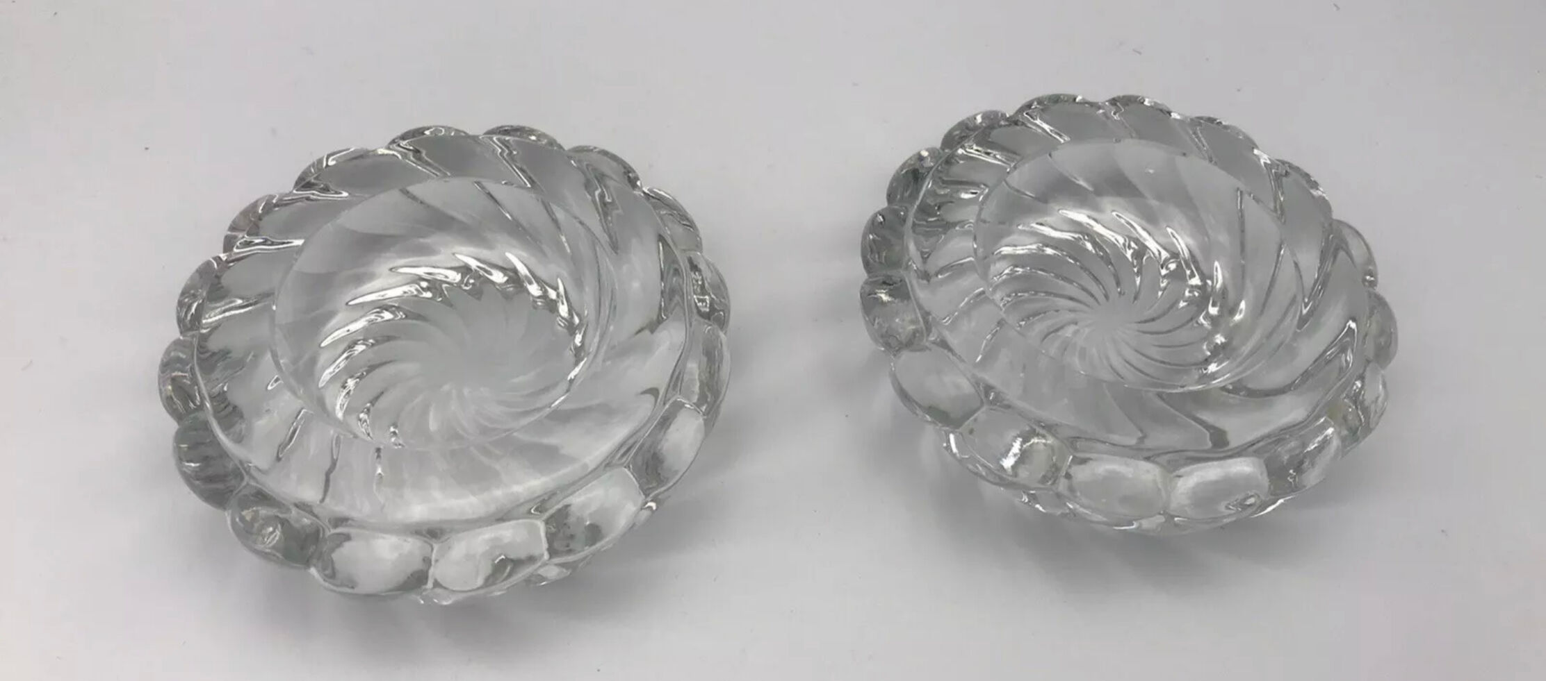 Pair of twisted round candlesticks in baccarat crystal stamped