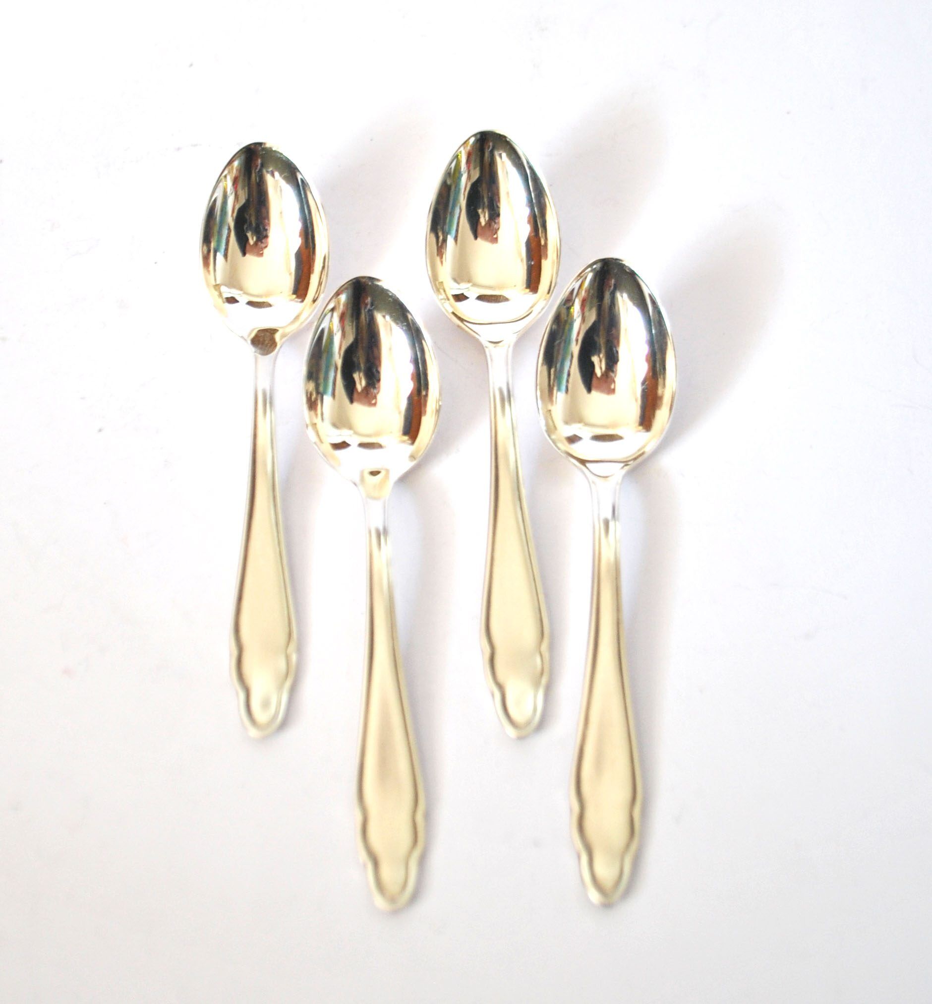 DEETJEN set of 4 silver-plated dessert spoons with a modernist scalloped design.