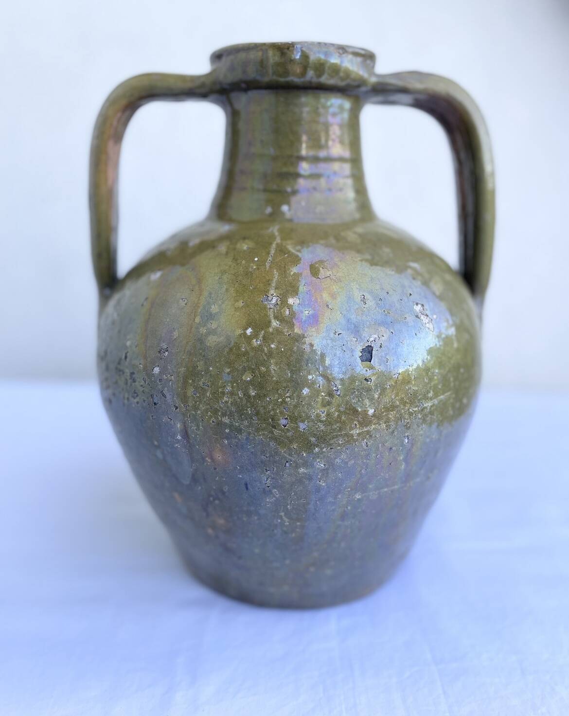 Ancient oil jar in glazed terracotta, khaki green — Auvergne, Lezou