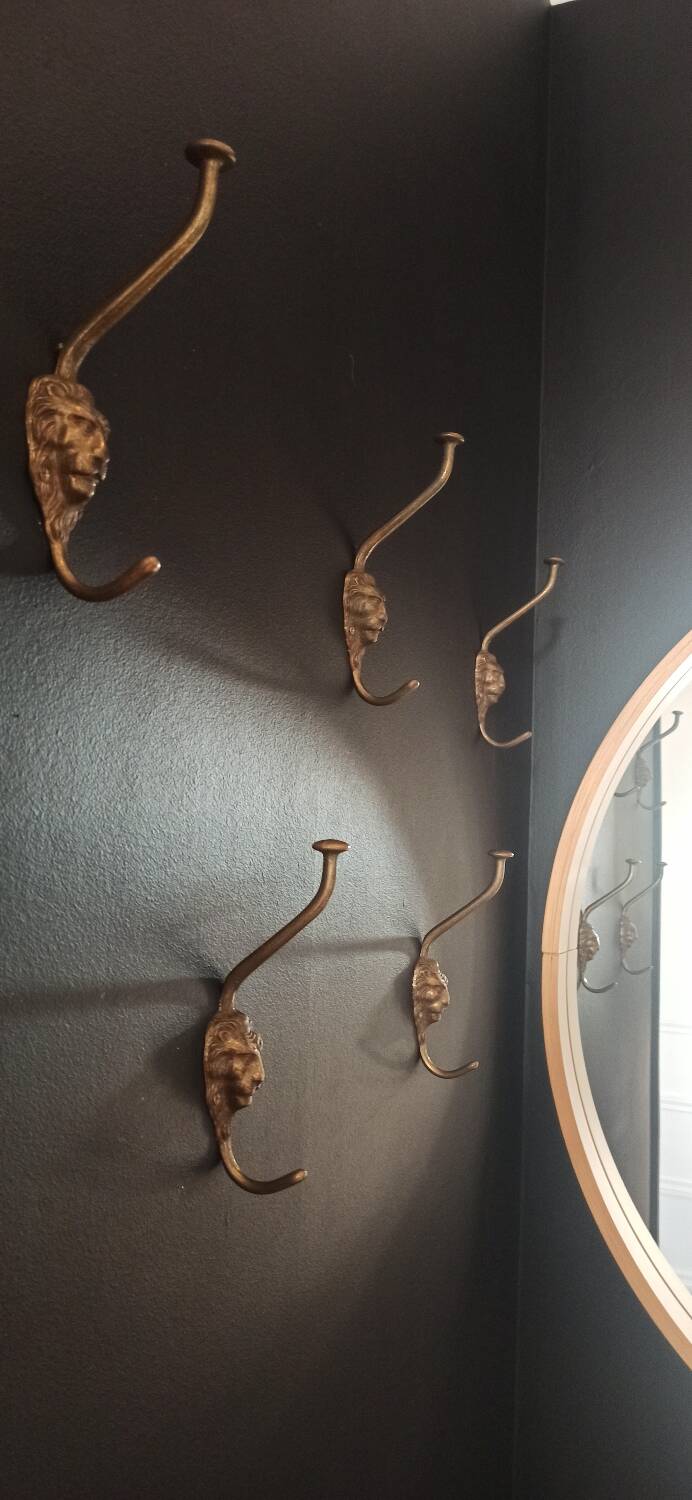 Set of 5 antique "Lion Head" coat hooks.