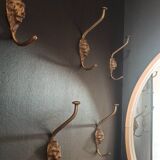 Set of 5 antique "Lion Head" coat hooks.