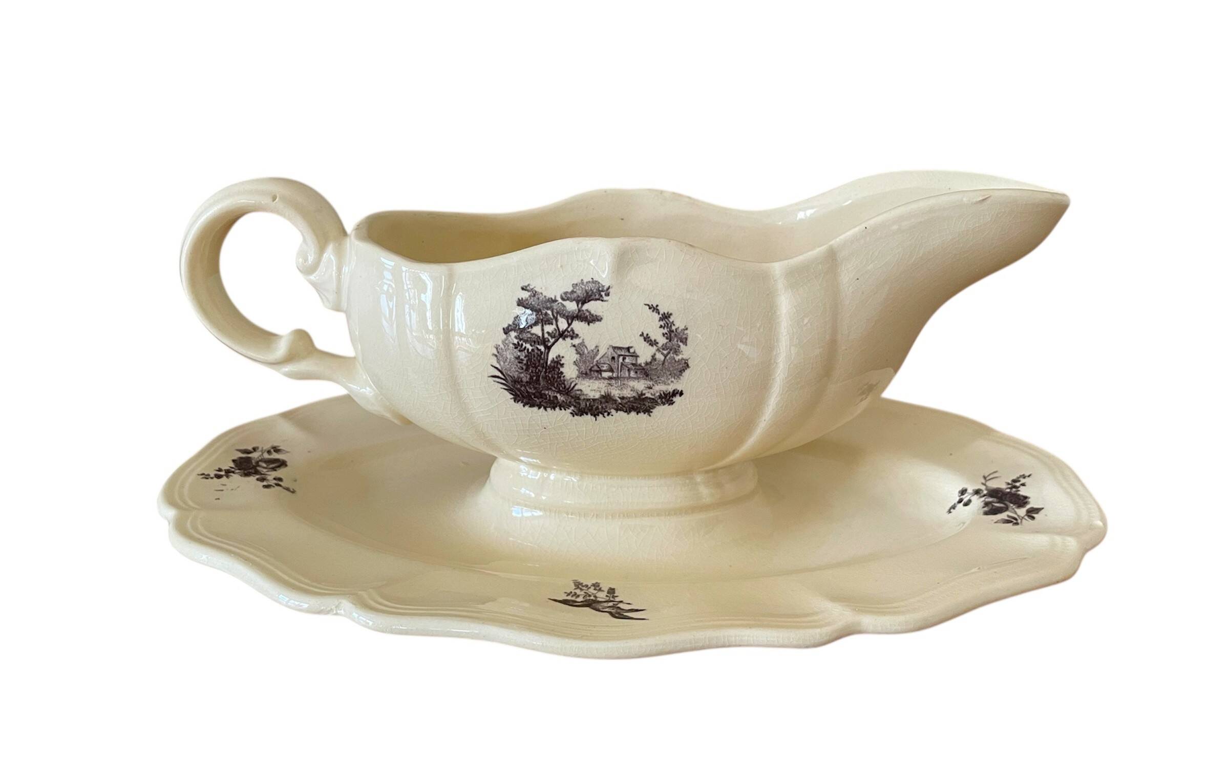 Antique sauce boat in Sarreguemines earthenware.