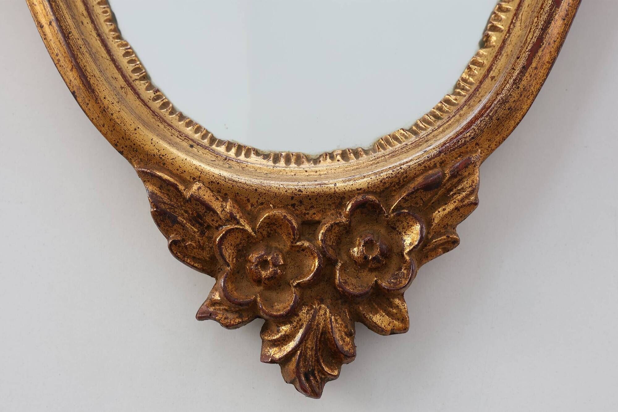 20th Century Louis XVI style giltwood mirror with ornate crest, France