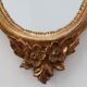 20th Century Louis XVI style giltwood mirror with ornate crest, France