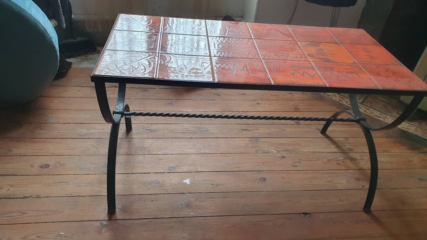 Wrought iron and orange ceramic coffee table