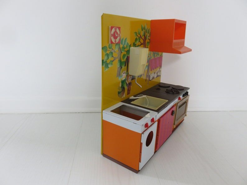 Kitchen doll, child in tole 70s