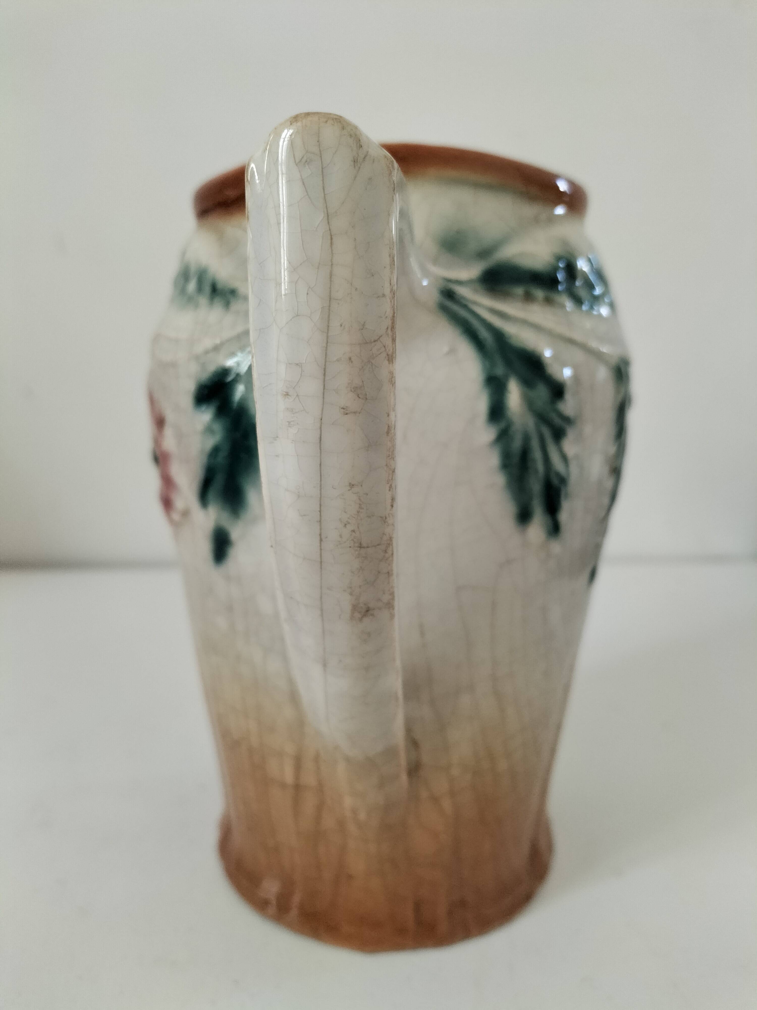 Moulded slip pitcher - late 19th century - Floral decoration in relief