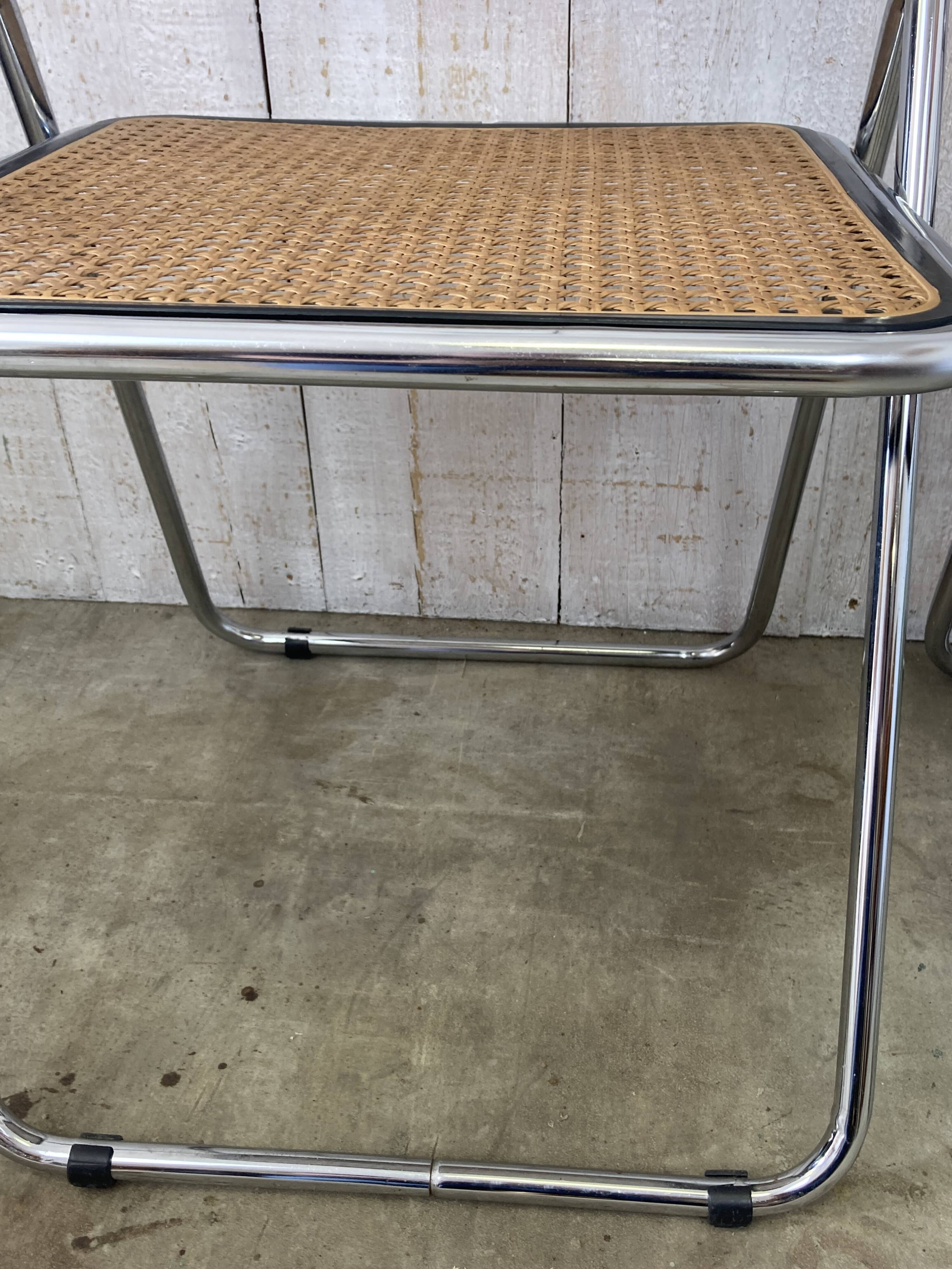 Pair of chrome and cane folding chairs
