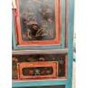 Restored antique Vietnamese wardrobe with care.
