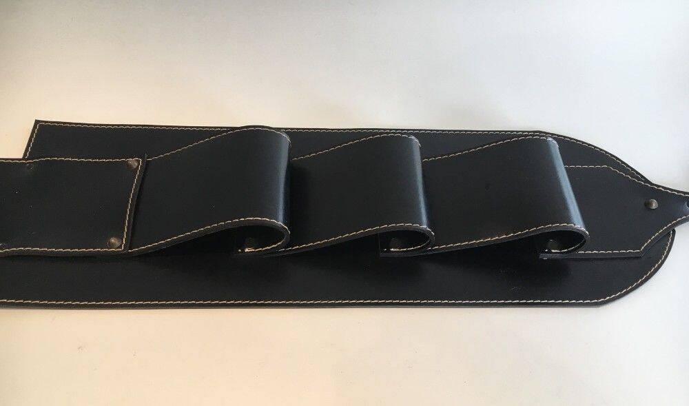 Leather wall-mounted magazine rack. Attributed to Jacques Adnet