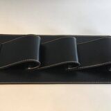 Leather wall-mounted magazine rack. Attributed to Jacques Adnet