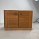 Low buffet with horizontal fronts and recessed handles in the spirit of the Regain house.