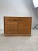Low buffet with horizontal fronts and recessed handles in the spirit of the Regain house.