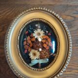 Oval frame with gold patina dried flowers