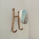 Vintage wall coat hook in brass and Bakelite.