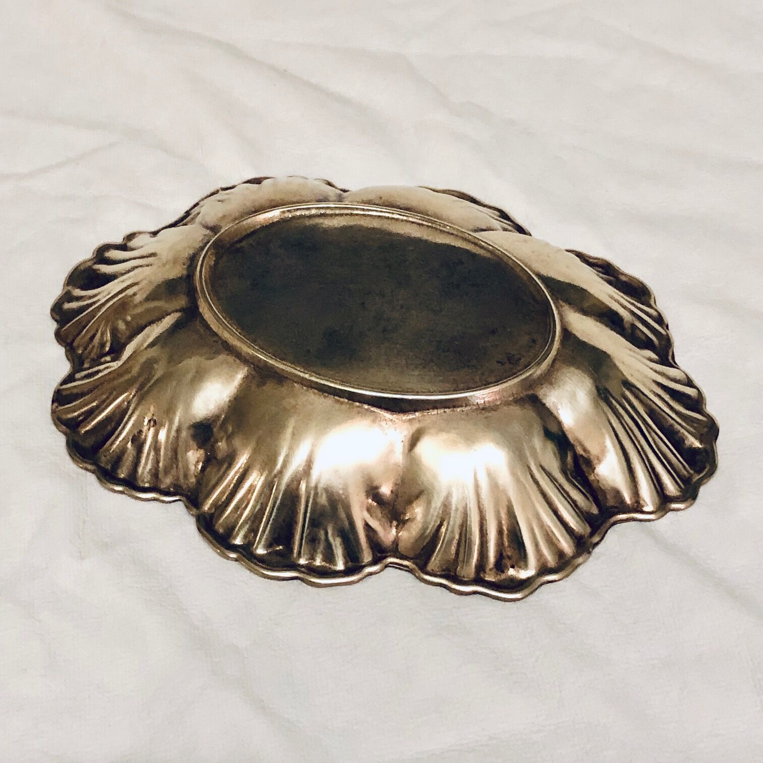 Empty oval brass pocket