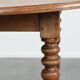 Antique English drop-leaf dining table made of walnut with elegant legs