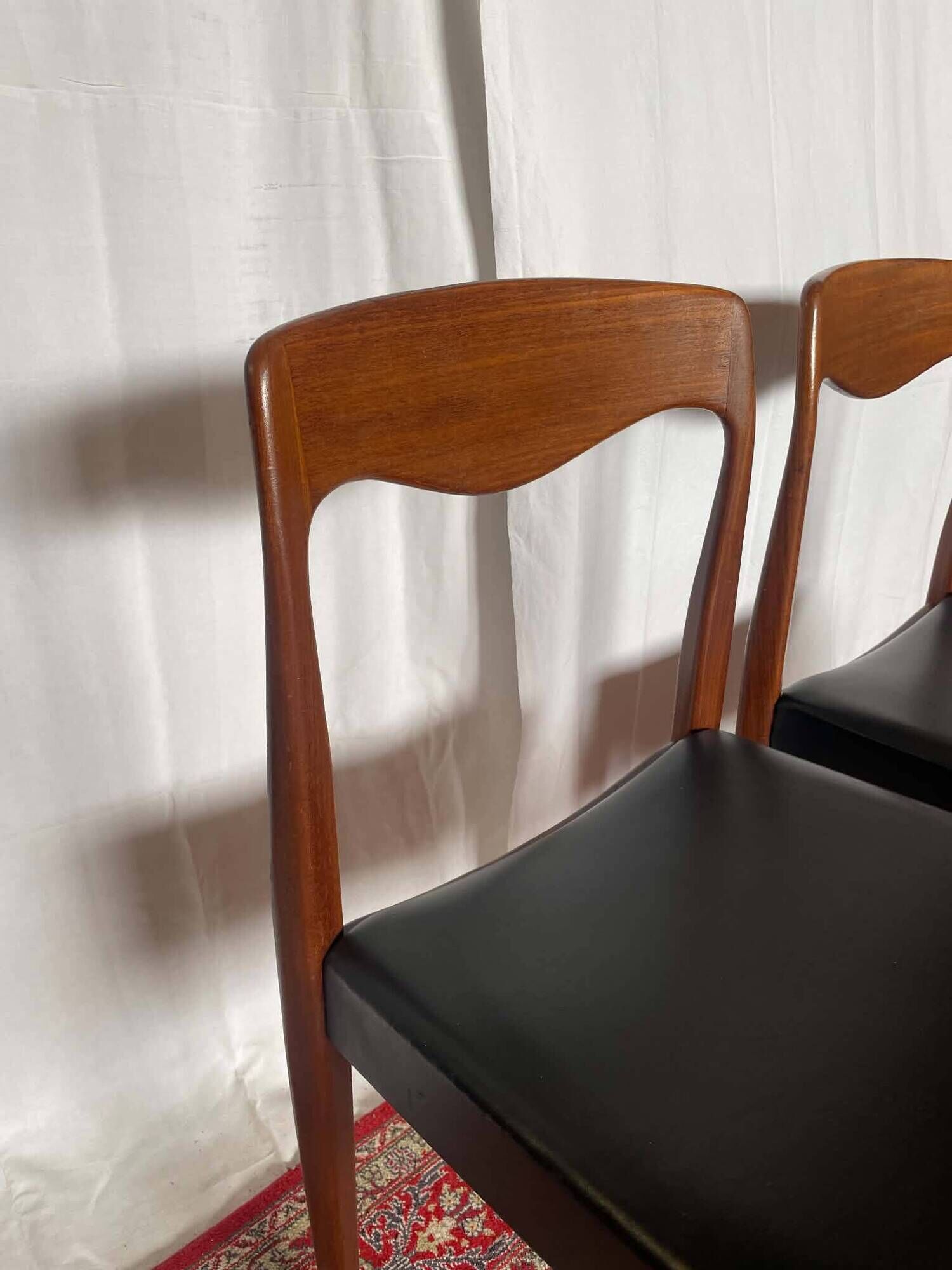 Pair of vintage teak chairs with black faux leather – Scandinavian style