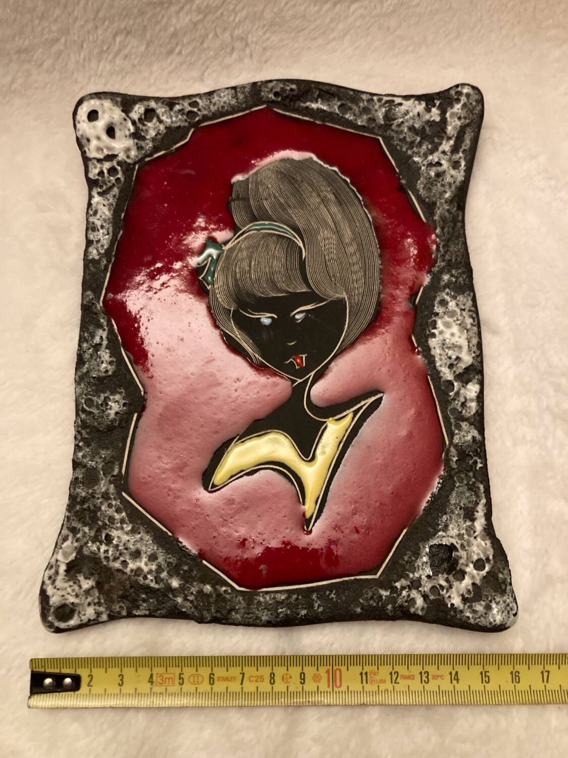 Vintage hanging decorative plate in lava stone