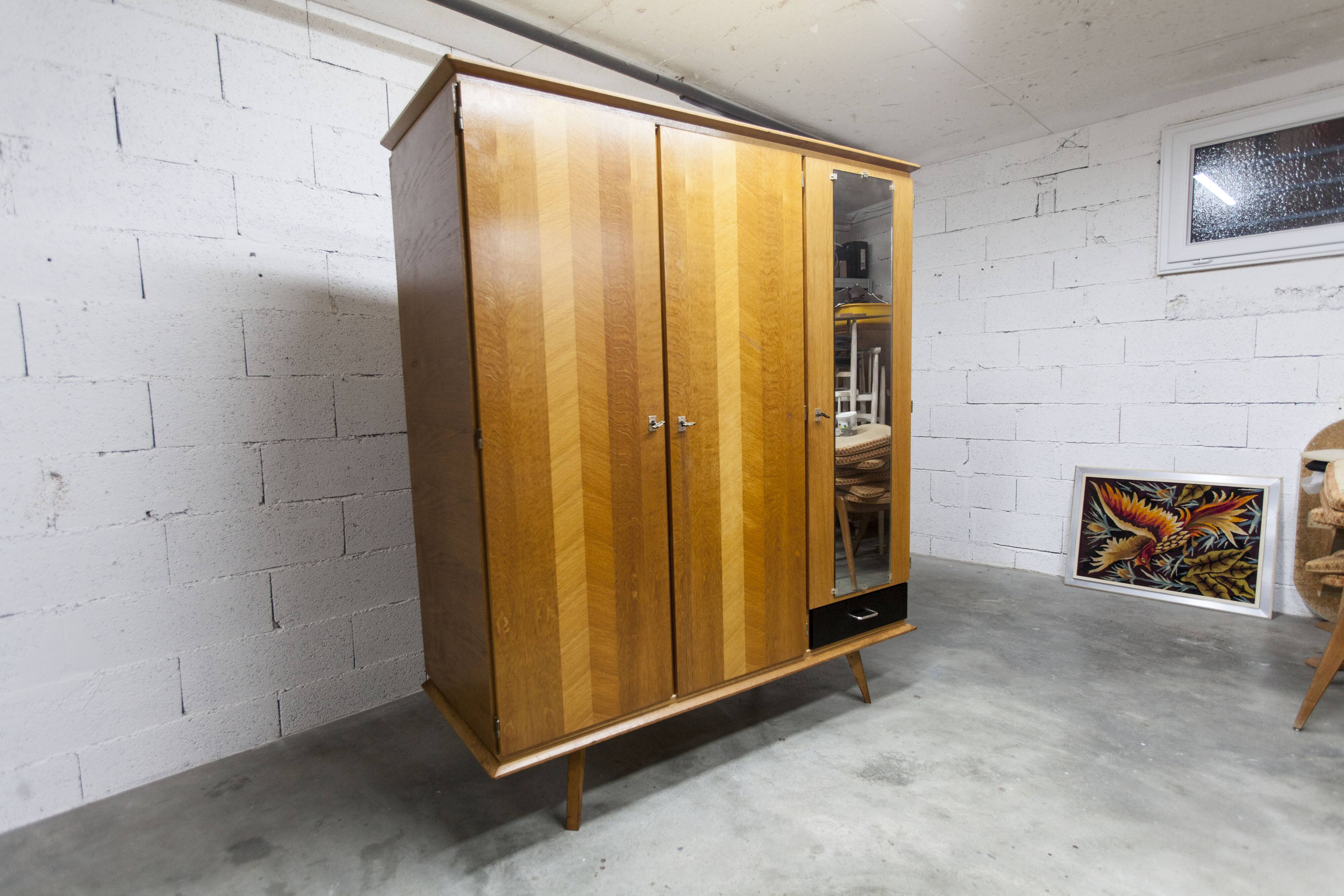 French wardrobe with tapered legs, 3 doors, 1 mirror (27*130), and 1 drawer.