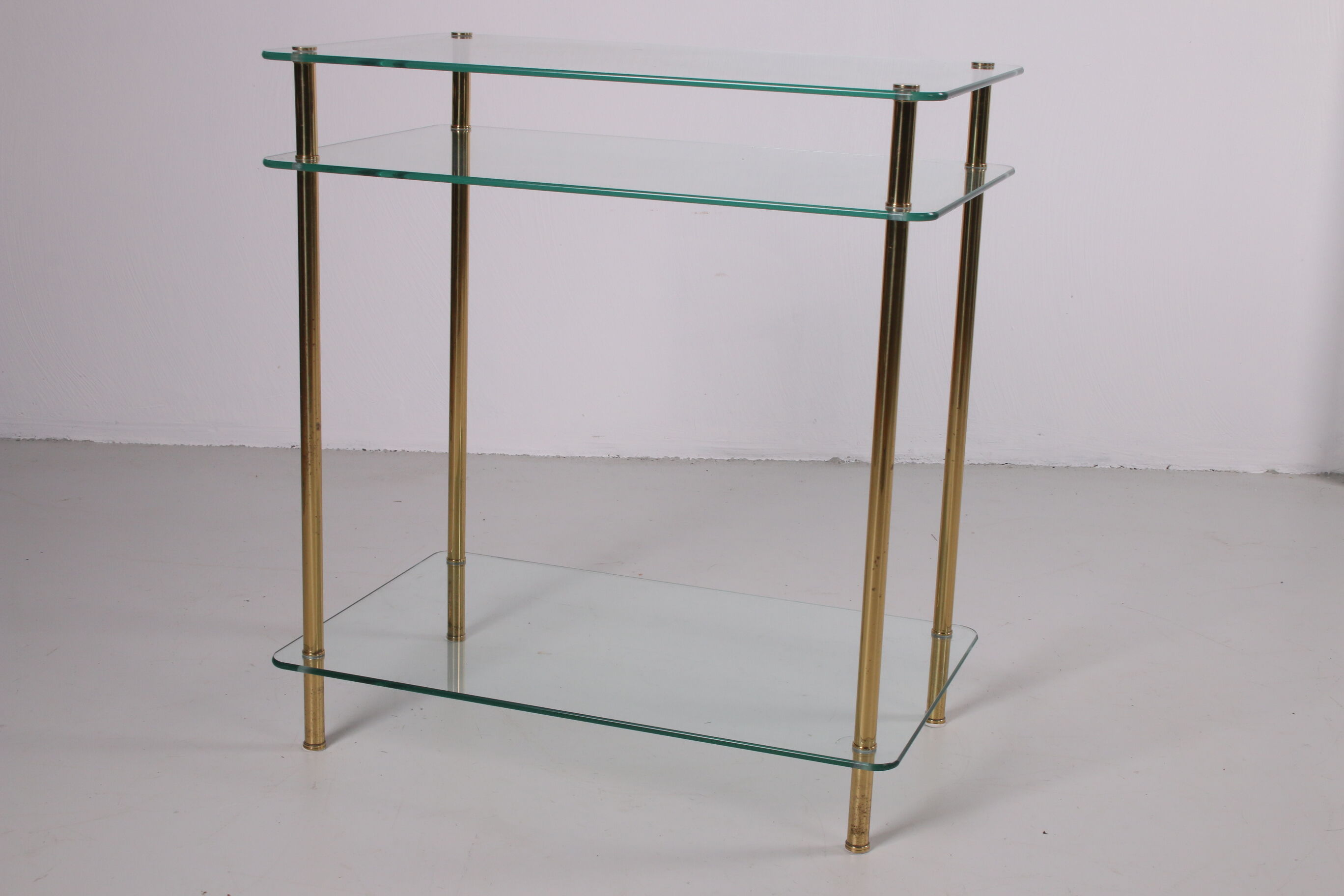 Hollywood Regency side table with gold-colored legs