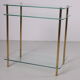 Hollywood Regency side table with gold-colored legs