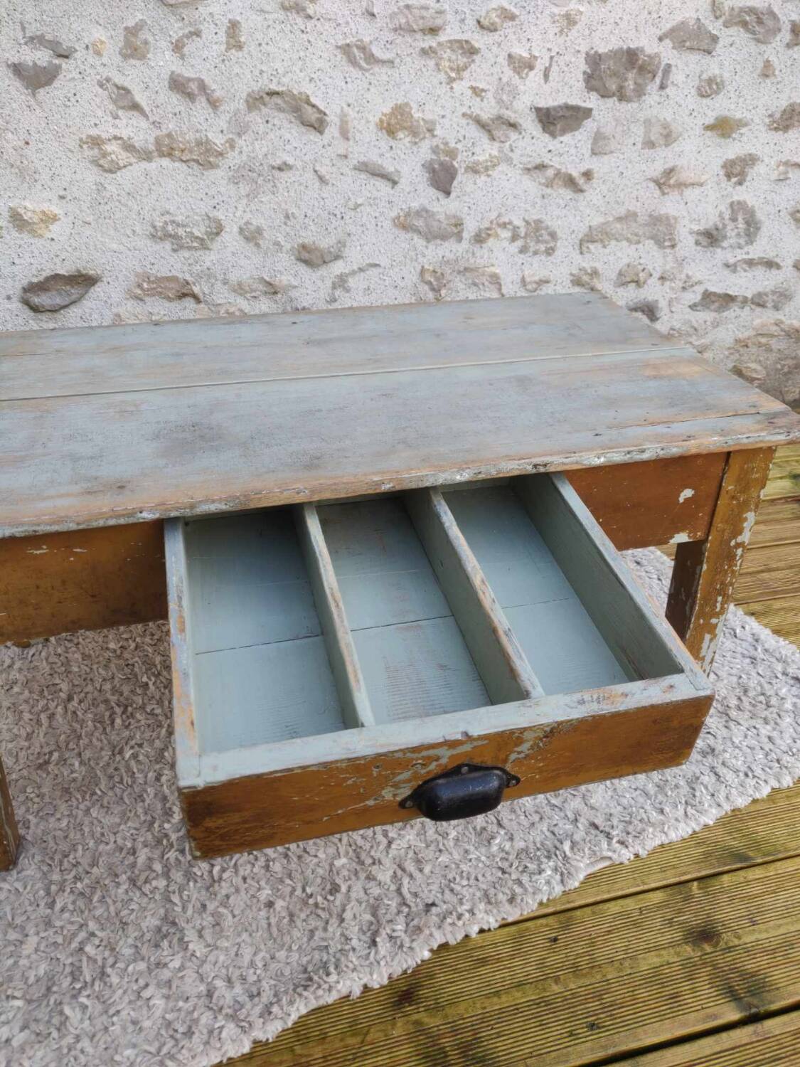 Patinated coffee table with a drawer