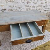 Patinated coffee table with a drawer