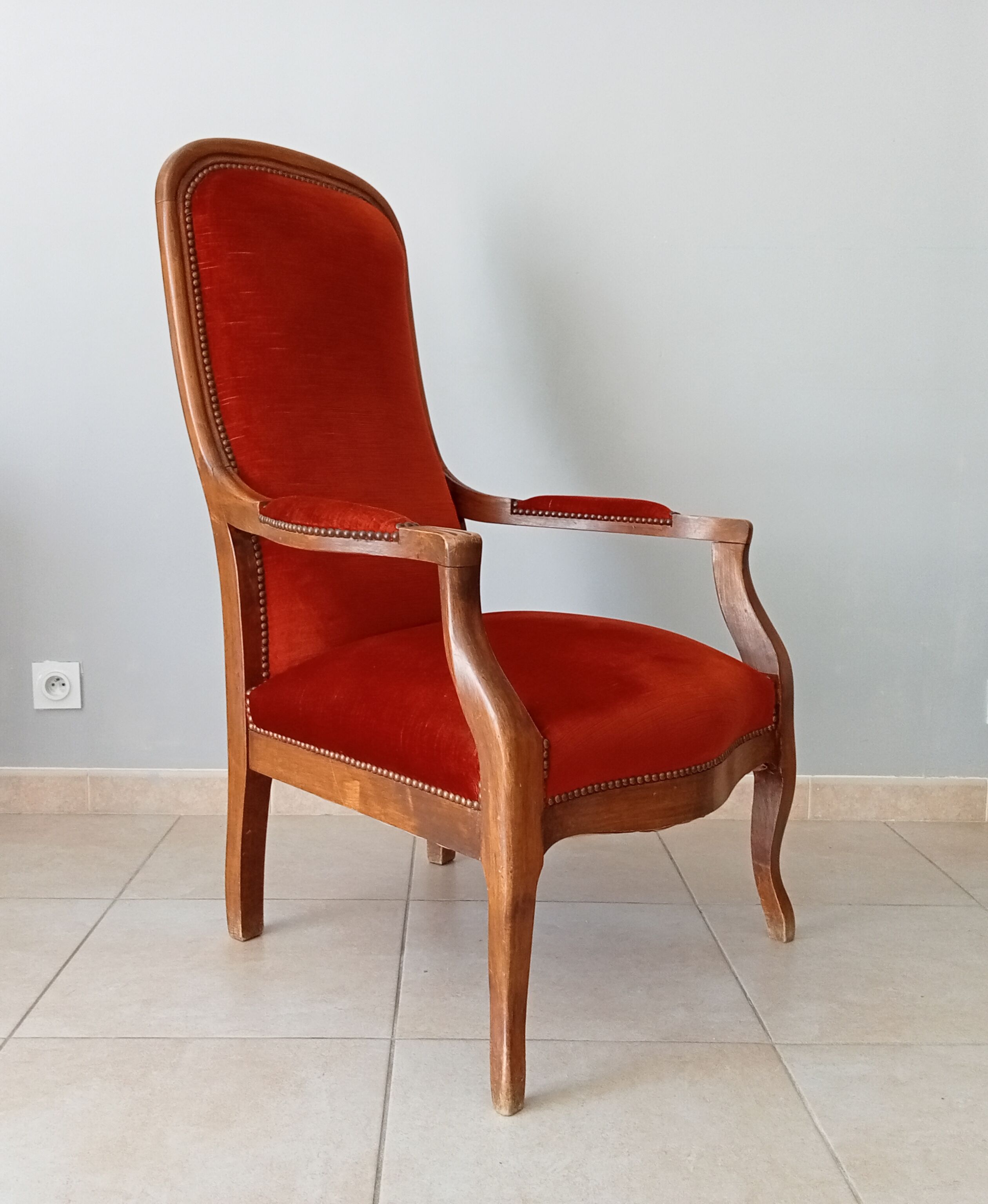 Walnut and velvet voltaire armchair
