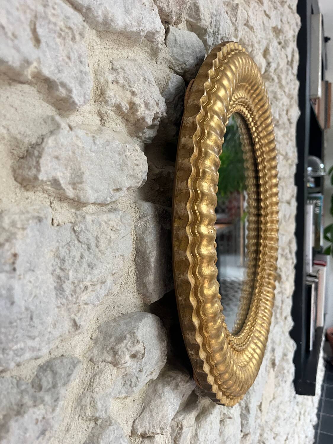 Pair of antique oval mirrors gilded with gold leaf and mercury.