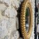 Pair of antique oval mirrors gilded with gold leaf and mercury.