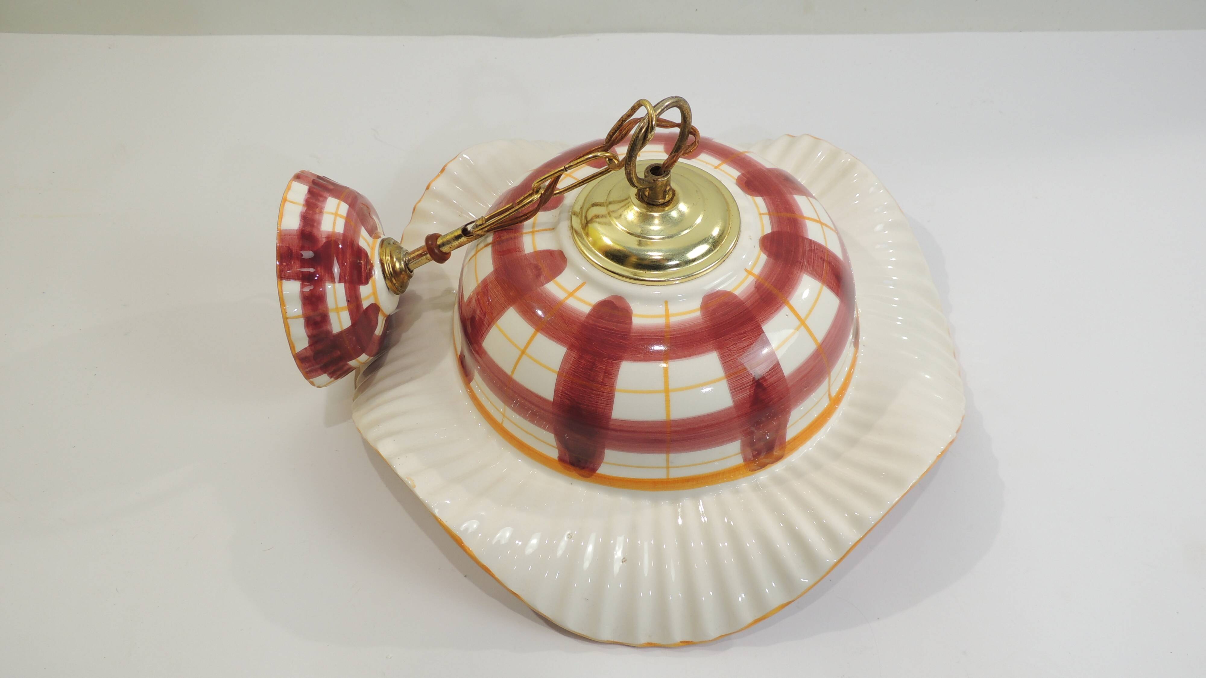 Vintage earthenware pendant light with a burgundy and ochre tartan pattern
