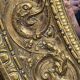 A. Arens, Antwerp, important oval mirror in repoussé brass with numerous animal decorations