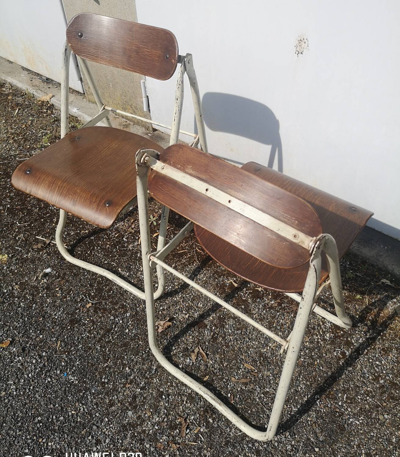 Pair of Bienaise model folding chairs from the Nelson brothers dating from the 1930s.