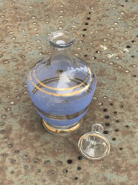 Blue granite glass carafe with vintage gold trim.