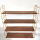 Wood-coloured metal string shelf and gold double studs 1960