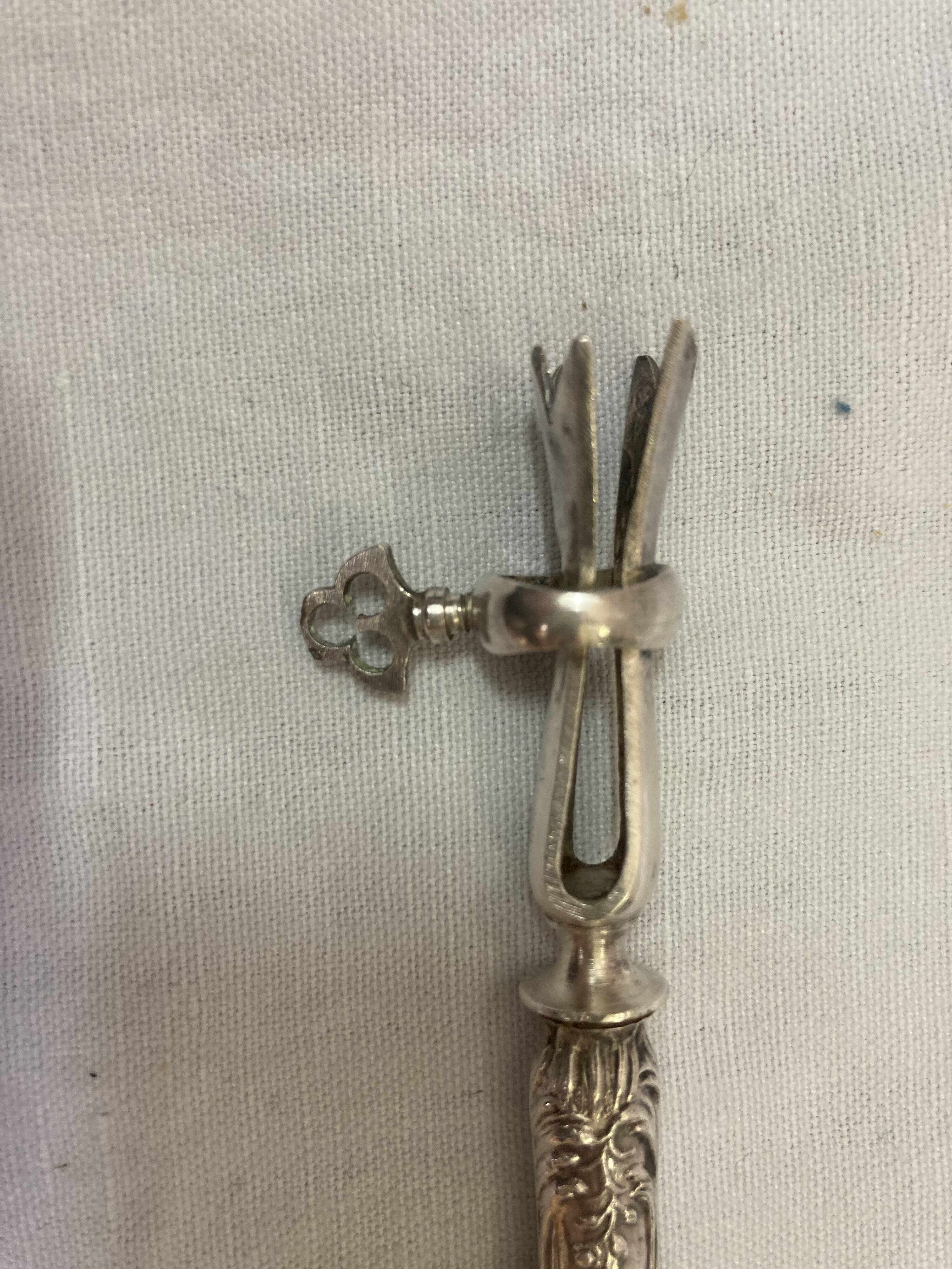 Silver duck sleeve clips, 19th century neck brace