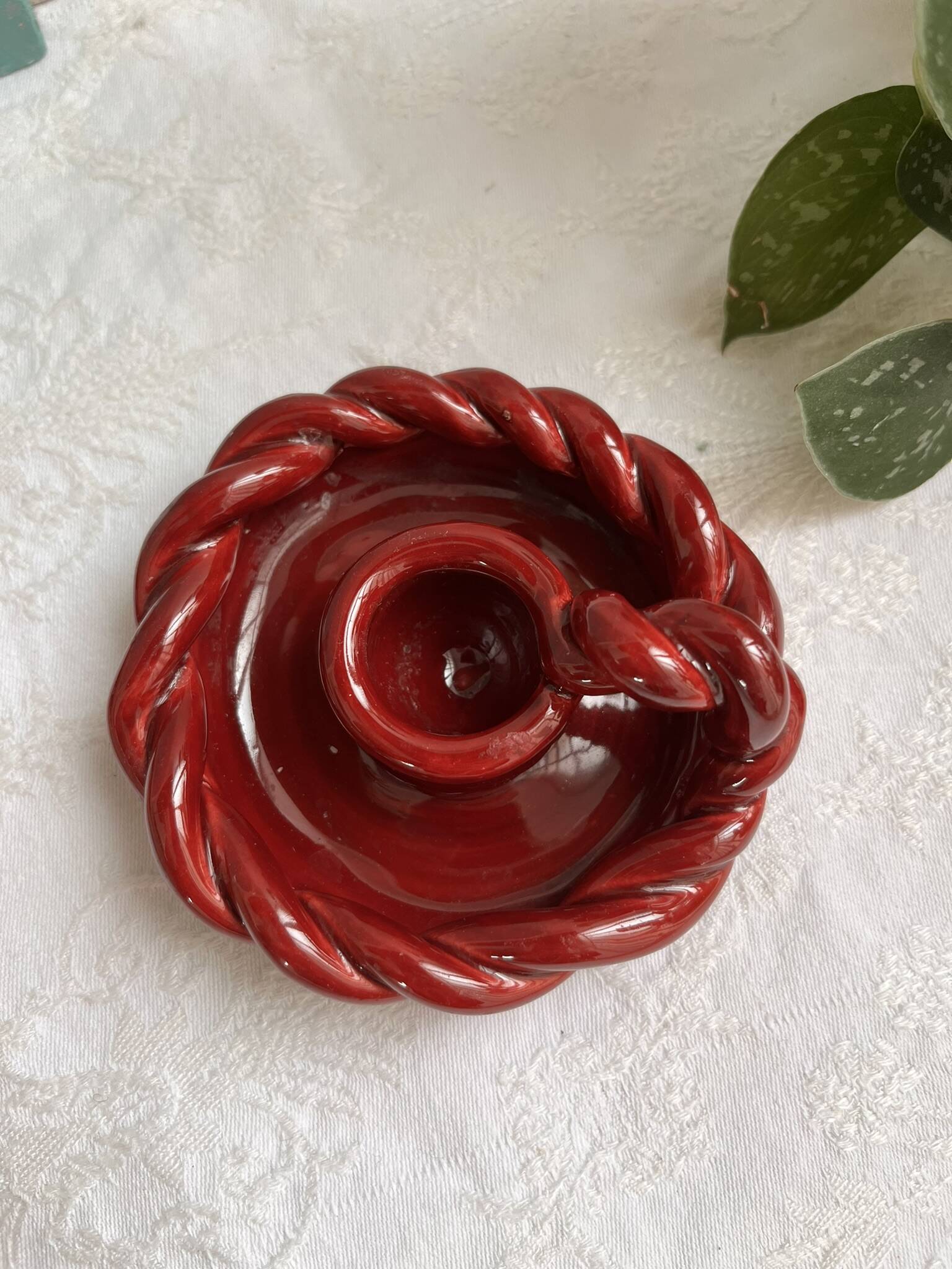 Twisted red earthenware candle holder - in the style of St Clément